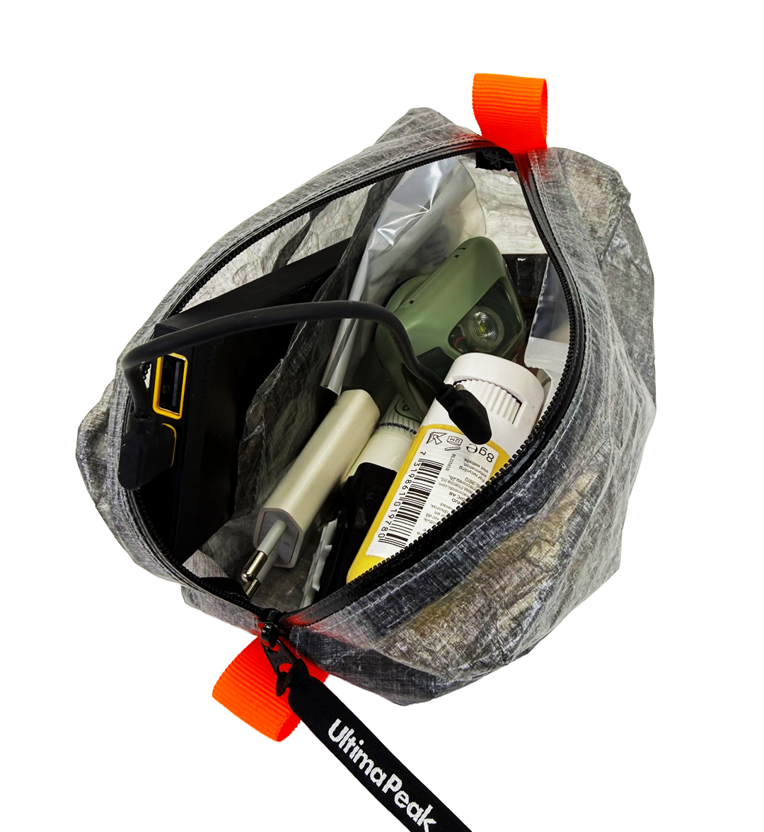 Open AeroStash ditty bag organized with trail electronics and accessories