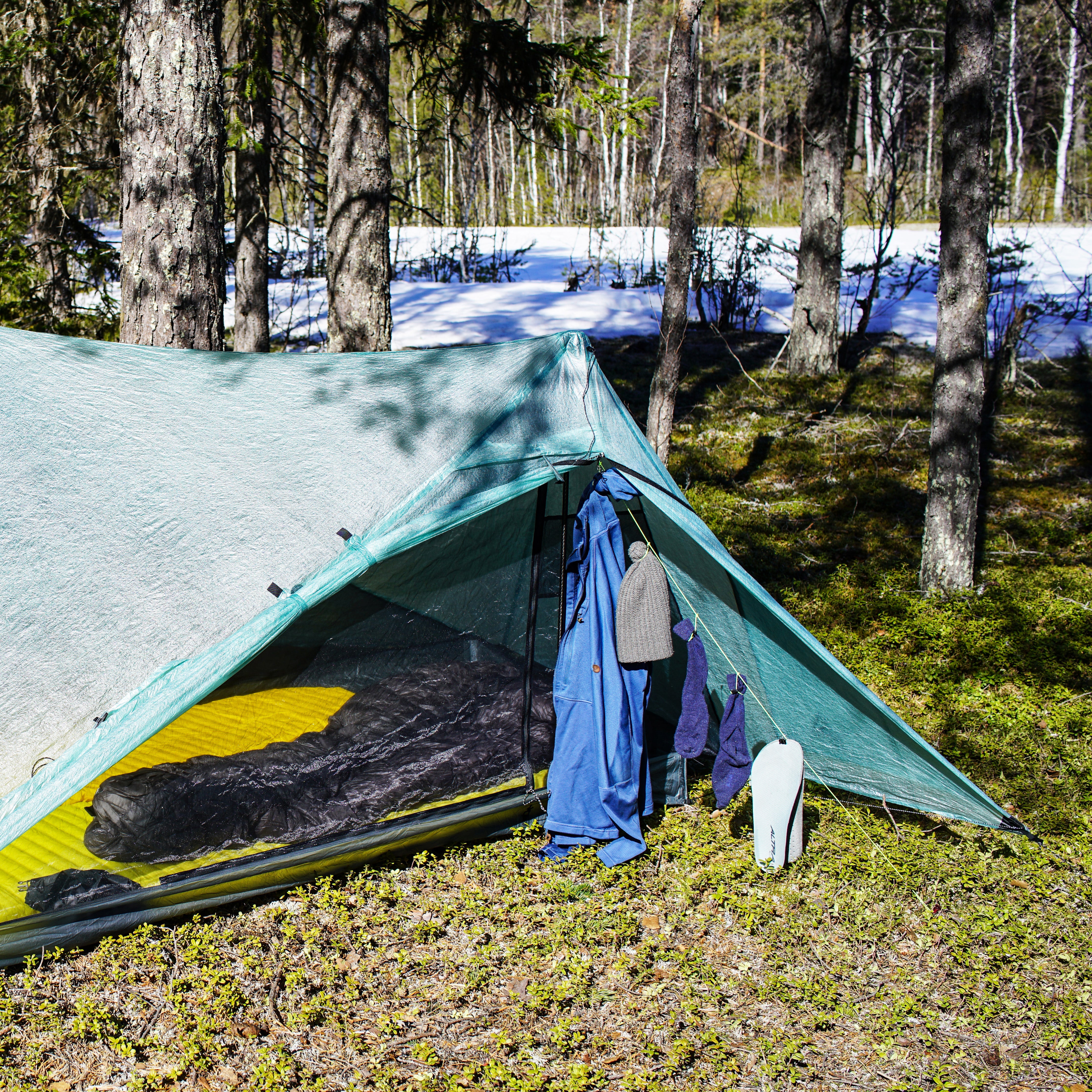 AeroDry clothesline installed inside a trekking-pole tent vestibule