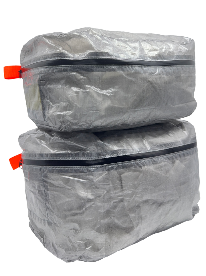 Three AeroCube ultralight Dyneema packing cubes stacked together