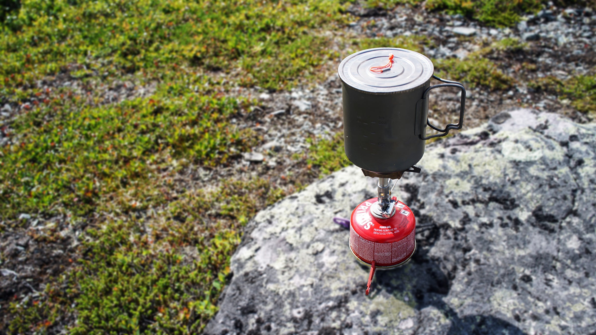 FeatherLid ultralight titanium lid on a backpacking cook pot