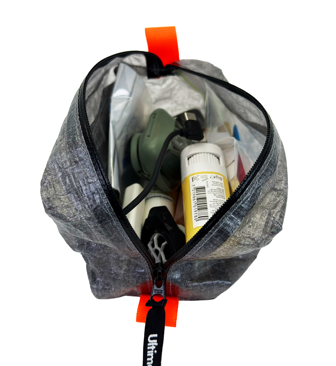 Open AeroStash ditty bag filled with small trail essentials
