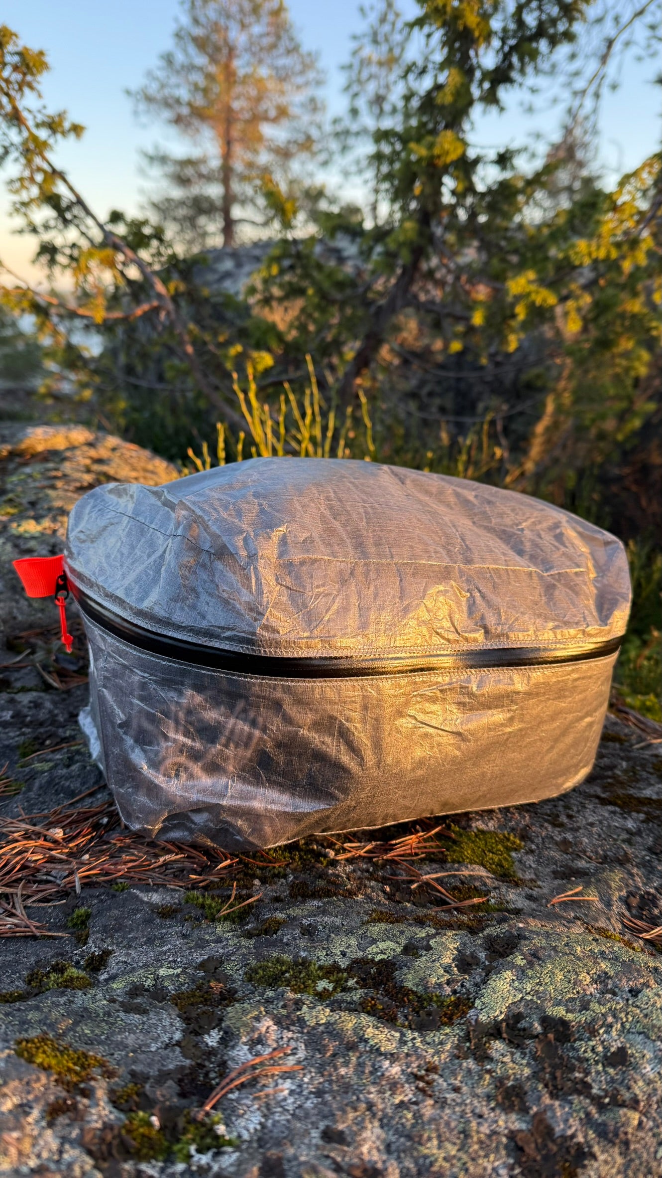 AeroCube packing cube filled with clothing outdoors