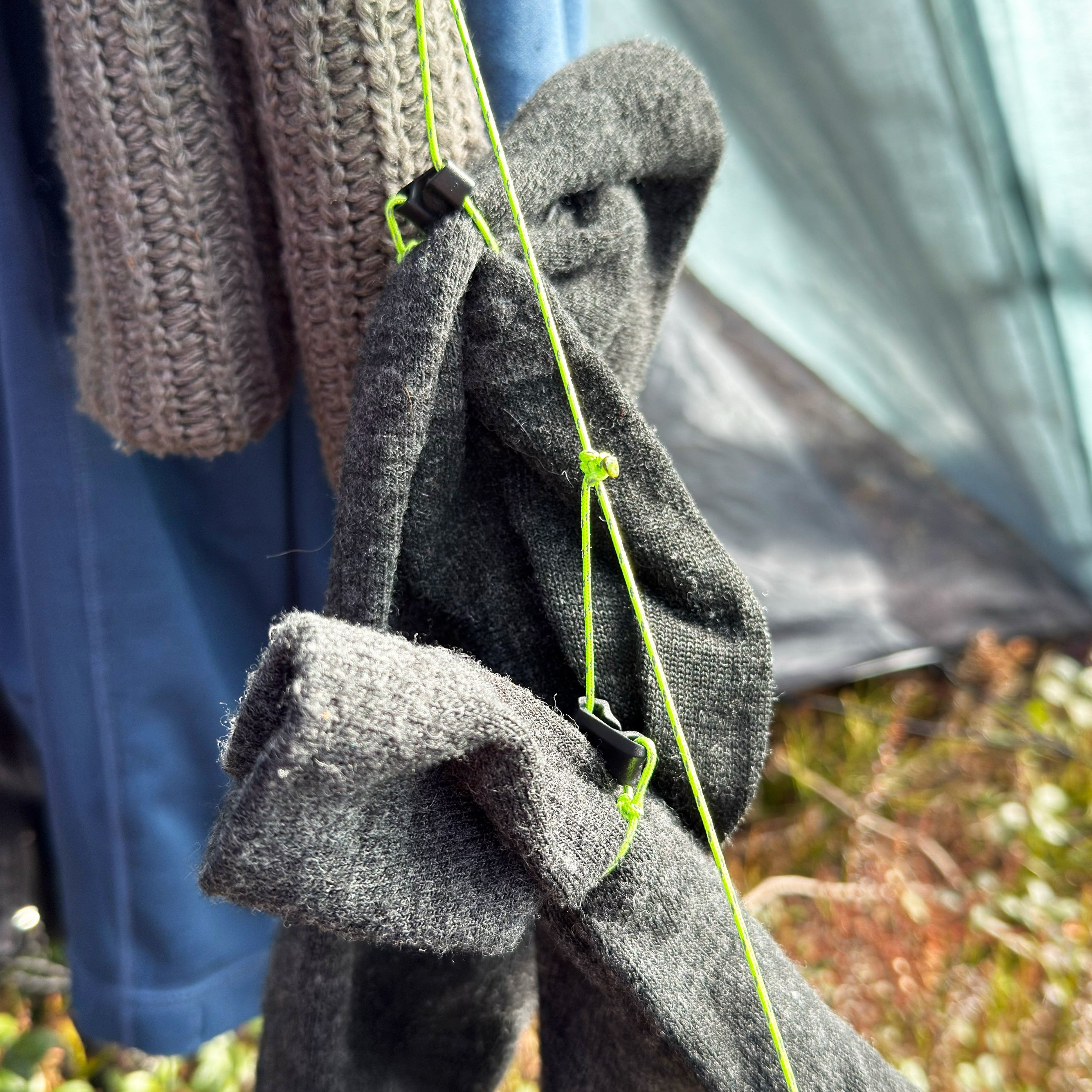 Socks drying from AeroDry inside a trekking-pole tent