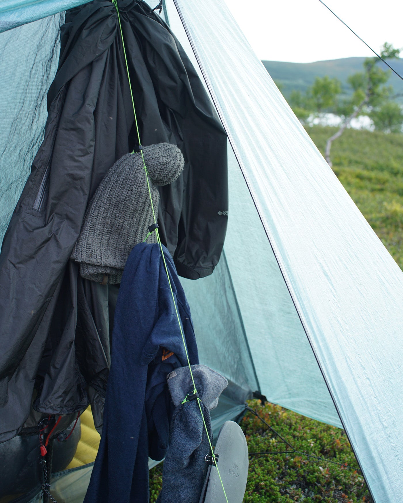 AeroDry drying clothing inside a trekking-pole tent vestibule
