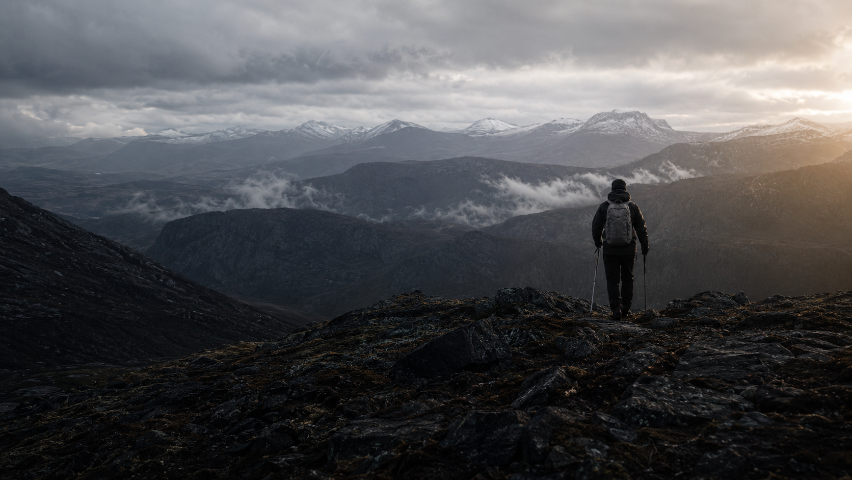 Hiker testing equipment in a mountain landscape